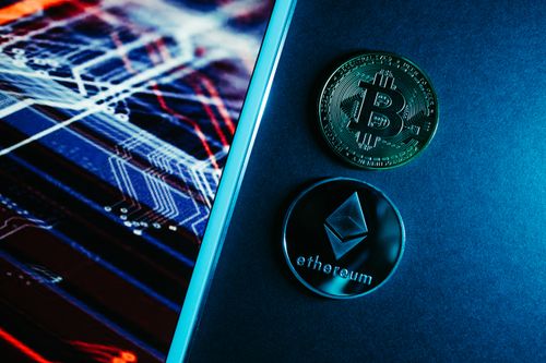 Bitcoin and Ethereum coins displayed over a digital circuitry background representing blockchain ledger backing. Photo: Pexels.